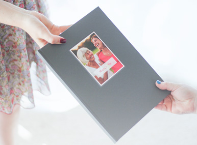 handing a photobook with deboss cover from generation to generation